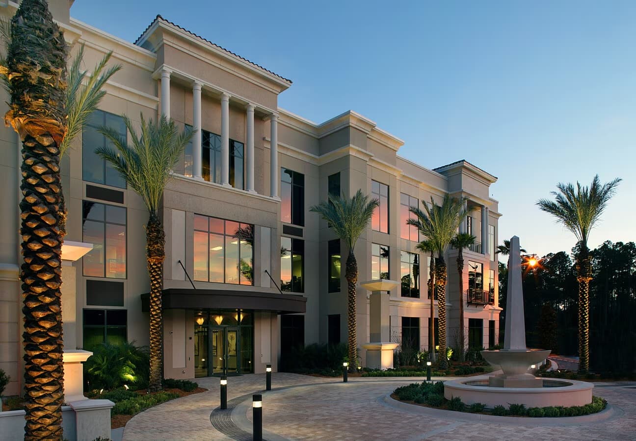 Infraxio office building exterior at sunset with palm trees
