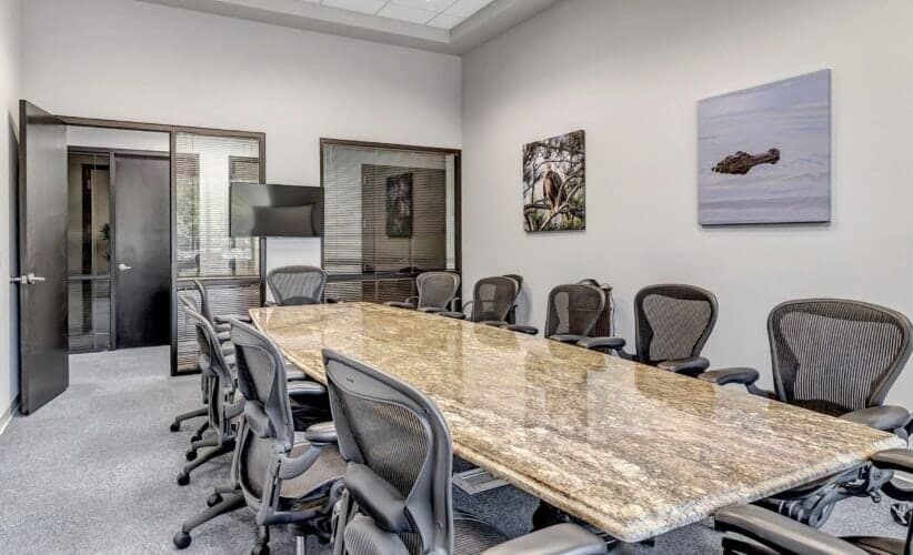 Infraxio conference room with marble table and executive seating